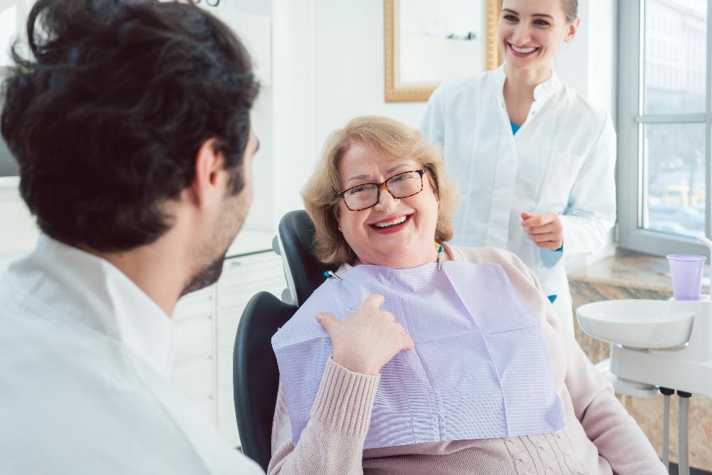 Older woman smiling in dental chair, clintonville oh