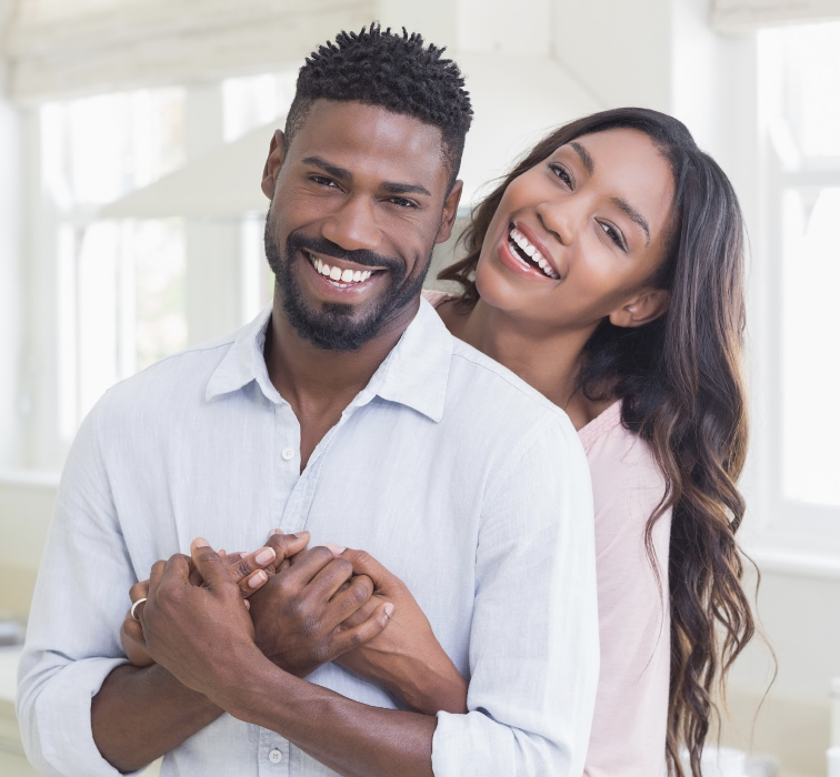 Black man and woman smiling and hugging, clintonville oh