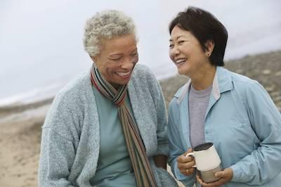 Older black and asian woman smiling together, clintonville ohio