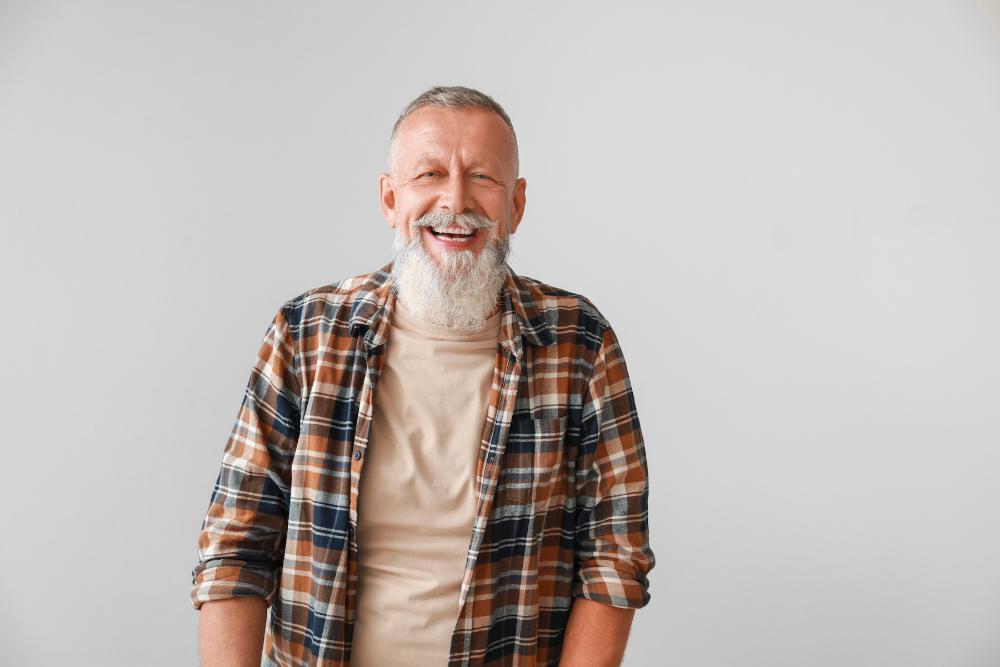 Older man smiling in a flannel, clintonville oh