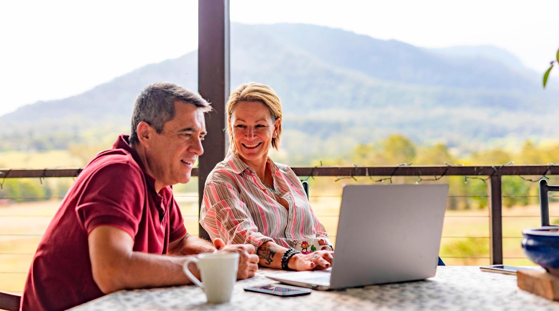 couple working on laptop l dentist near me