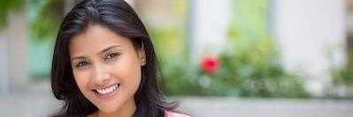 woman with dark hair smiling l dentist columbus oh