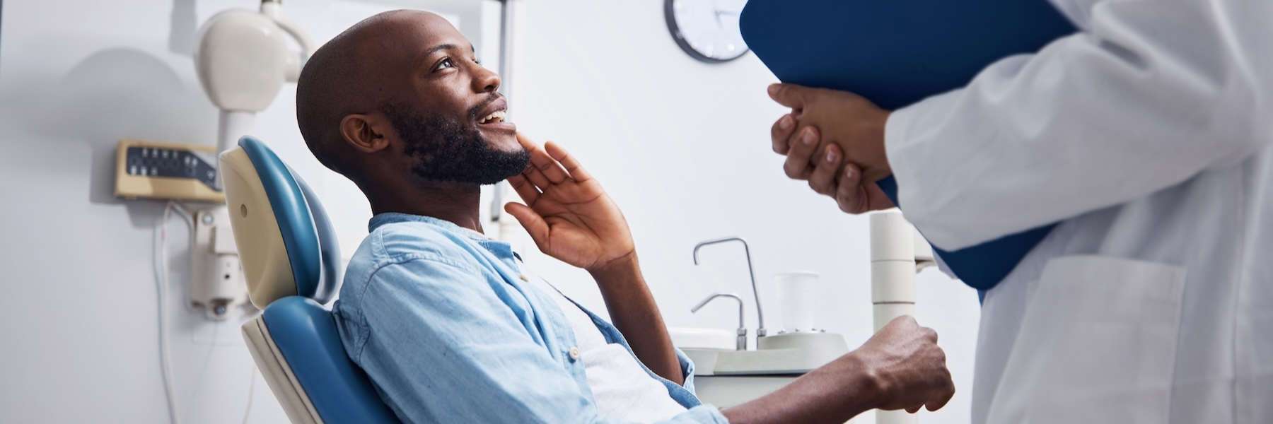 Black man holding his mouth in pain, clintonville ohio