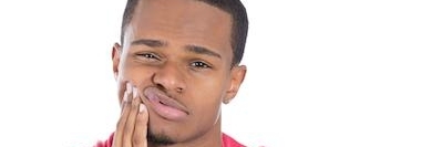 man in pain holding jaw | dentist columbus ohio