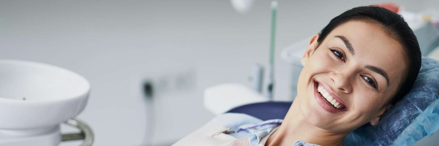 Brunette woman in dental chair smiling, clintonville ohio