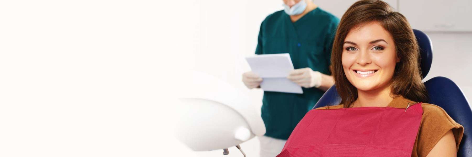 Brunette woman in dental chair smiling, clintonville ohio