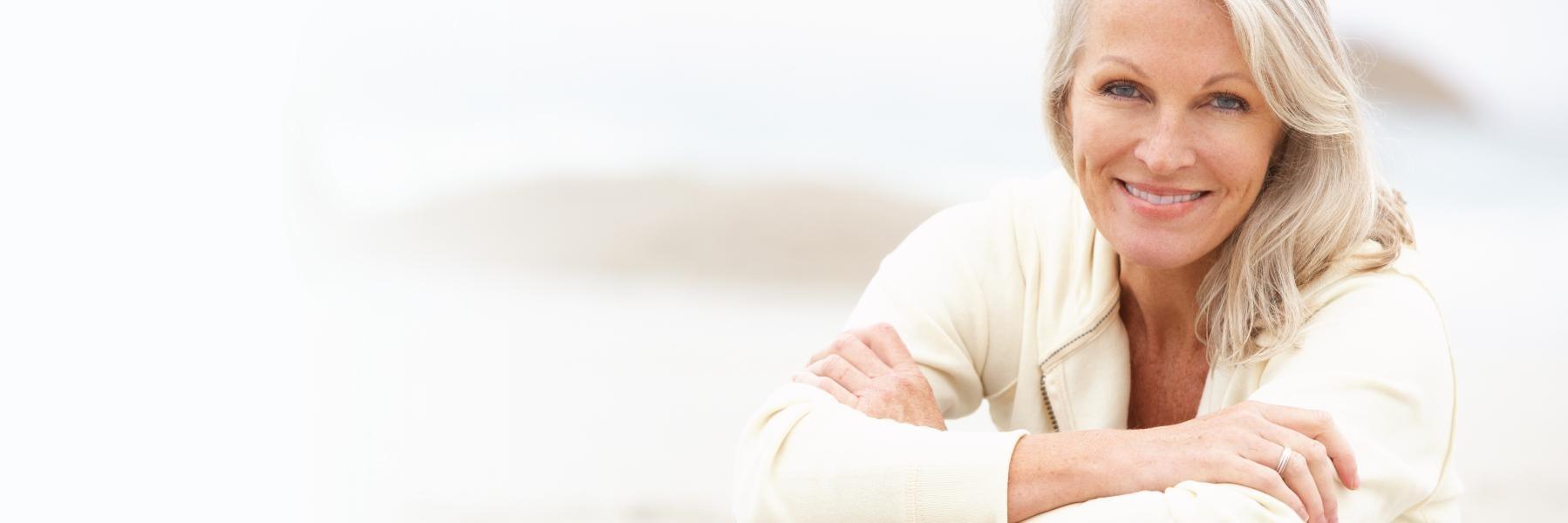 older woman with grey hair smiling l affordable dentures columbus
